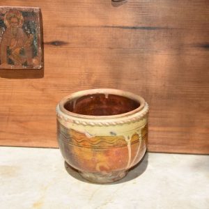 A SMALL GLAZED CERAMIC PLANTER